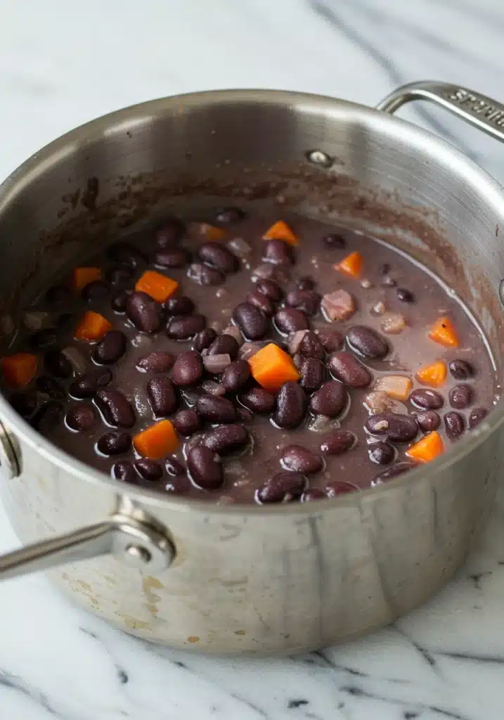 Close-up of purple black bean soup simmering