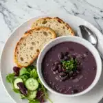 Purple black bean soup served alongside crusty sourdough bread and a small salad (3)