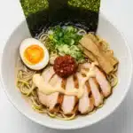 Overhead shot of Fiery Chicken Ramen in a white ceramic bowl (3)
